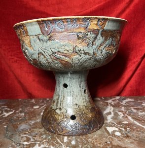 Large Cornish Studio Pottery 'Good Cheer Upon This House' Fruit Bowl Circa - 1970 Composition - Earthenware Listing Description Large Ornamental Studio Pottery Fruit Bowl On Stand. Top Bowl For Holding Fruit Or Decorative Items, Shaped Like A Spherical Cap And Set Upon Tapered Base With Circular Vent Holes. Wonderful Hand Etched Pattern Of Oak Leaves With Entwined Majestical Flowers, With The Top Edge Of The Bowl Reading 'Good Cheer Upon This House' In Scripture Style Text. Fruit Bowl Finished With Rich Kiln Sage Green And Brown Glaze. A Interesting And Very Useful Piece In Pristine Condition. Dimensions in Inches Height 11" X Top Diam 12" For Further Information Please Call The Curator On 07707 488 566 Thank-you.