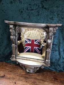 Italian Reproduction Silver Serpentine Shaped Cherub Pier Glass Mirror Ornate Pillars Adorned With Cherubs Heads Bow Fronted Top With Ornate Scrollwork Stunning Shaped Ornate Base Made In Resin Very Heavy Item 22Kg Approx Brackets At The Back For Hanging Dimensions In Inches Height 22” Width 20” Depth 5.5”