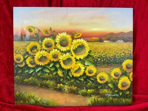 American 20th Century Artist Charles Redmond Bernolt Impasto Oil Painting Titled Field Of Sunflowers Circa - 20th Century Composition - Oil On Canvas Vibrant Sunflower Filled Landscape Painting. The Front Row Of Large Sunflowers In Thick Impasto Paint Effect With Three Dimensional Textural Appearance. In The Distance A Field Filled With Thousands Of Sunflowers. Fabulous Perspective Showcasing Rich Pink Sunset Over The Sea And Mountainous Backdrop. Amazing Detail By Accomplished Artist Charles Redmond Bernolt Signed Right Bottom Corner. Unframed. Dimensions In Inches Height 20" X Width 23 3/4" For Further Information Please Call The Museum Curator On 07707 488566 Thank-you