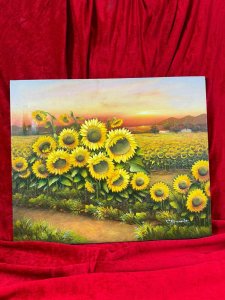 American 20th Century Artist Charles Redmond Bernolt Impasto Oil Painting Titled Field Of Sunflowers Circa - 20th Century Composition - Oil On Canvas Vibrant Sunflower Filled Landscape Painting. The Front Row Of Large Sunflowers In Thick Impasto Paint Effect With Three Dimensional Textural Appearance. In The Distance A Field Filled With Thousands Of Sunflowers. Fabulous Perspective Showcasing Rich Pink Sunset Over The Sea And Mountainous Backdrop. Amazing Detail By Accomplished Artist Charles Redmond Bernolt Signed Right Bottom Corner. Unframed. Dimensions In Inches Height 20" X Width 23 3/4" For Further Information Please Call The Museum Curator On 07707 488566 Thank-you