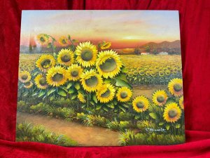 American 20th Century Artist Charles Redmond Bernolt Impasto Oil Painting Titled Field Of Sunflowers Circa - 20th Century Composition - Oil On Canvas Vibrant Sunflower Filled Landscape Painting. The Front Row Of Large Sunflowers In Thick Impasto Paint Effect With Three Dimensional Textural Appearance. In The Distance A Field Filled With Thousands Of Sunflowers. Fabulous Perspective Showcasing Rich Pink Sunset Over The Sea And Mountainous Backdrop. Amazing Detail By Accomplished Artist Charles Redmond Bernolt Signed Right Bottom Corner. Unframed. Dimensions In Inches Height 20" X Width 23 3/4" For Further Information Please Call The Museum Curator On 07707 488566 Thank-you