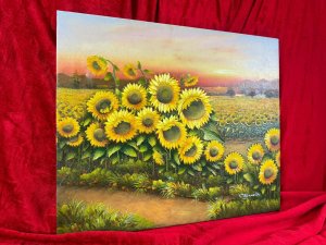American 20th Century Artist Charles Redmond Bernolt Impasto Oil Painting Titled Field Of Sunflowers Circa - 20th Century Composition - Oil On Canvas Vibrant Sunflower Filled Landscape Painting. The Front Row Of Large Sunflowers In Thick Impasto Paint Effect With Three Dimensional Textural Appearance. In The Distance A Field Filled With Thousands Of Sunflowers. Fabulous Perspective Showcasing Rich Pink Sunset Over The Sea And Mountainous Backdrop. Amazing Detail By Accomplished Artist Charles Redmond Bernolt Signed Right Bottom Corner. Unframed. Dimensions In Inches Height 20" X Width 23 3/4" For Further Information Please Call The Museum Curator On 07707 488566 Thank-you