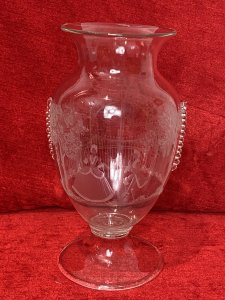 French Antique 19th Century Palace Of Versailles Etched Glass Decorative Vase. Circa - 1850 Origin - France Fine Quality Beautifully Detailed And Hand Crafted Etched Glass Vase With Overlaid Glass Ornamentation. Bouquet Shaped Vase With Round Glass Plinth Base Pediment. The Front Depicting The Palace Of Versailles Grand Entrance Gates With Column Pillars Adorned With Putti. On The Reverse Male And Female Believed To Be Marie Antoinette & Louis XVI Posed Figures In Traditional 18th Century Clothing In Stunning Tree Veranda Scene. Hand Blown Pontil Mark On The Base. Finely Engraved But Craftsman Unknown No Makers Mark. Dimensions In Inches Height 9 1/2” Width 5 1/4” Neck Diam 4.5” Base Diam 4.5”