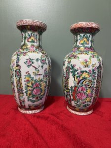 Pair Of Oriental Chinese Qing Style Famille Rose Vases Circa - 1940 Composition - Porcelain Listing Description The Famille Rose Style Defined By Predominantly Pink, White, Yellow And Green Colour Palette, Became Popular In China During The 18th Century And What We Call The 'Qing Dynasty'. The Famille Rose Vases Are Botanical Masterpieces Adorned With Delicate Frames Of Floral Sprays And Bouquets Of Peonies As Well As Many Butterflies And Birds Native To China. A Highly Decorative Pair Of Vases, Delicately Hand Painted In A Lovely Size. Stunning Condition. Dimensions In Cms Height 30.5cm x Width 16cm (Widest Point) X Mouth 10cm/ Base 10cm For Further Information Please Call The Museum Curator On 07707 488566 Thank-you.