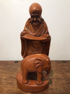 Asian Carved Fruitwood Buddha Statue Reading A Scroll With Elephant At His Feet Well Carved Solid Wood Lovely Patina And Interesting Subject Dimensions In Inches Height 13” Base Width 4.5”