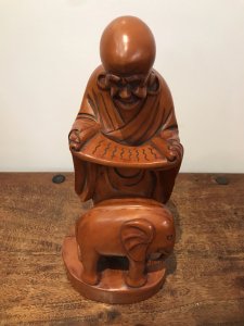 Asian Carved Fruitwood Buddha Statue Reading A Scroll With Elephant At His Feet Well Carved Solid Wood Lovely Patina And Interesting Subject Dimensions In Inches Height 13” Base Width 4.5”