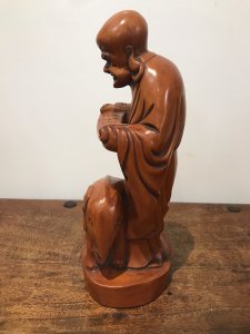 Asian Carved Fruitwood Buddha Statue Reading A Scroll With Elephant At His Feet Well Carved Solid Wood Lovely Patina And Interesting Subject Dimensions In Inches Height 13” Base Width 4.5”