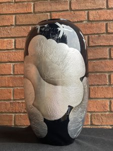 Large Contemporary Black Fire Glazed Vase Decorated With Silver Peony & Dragonflies. Circa - Modern Vintage Composition- Fire Glazed Pottery Stunning Large Bulbous Shaped Black Fire Glazed Centre Piece Vase. Hand Decorated With Embellished Textural Silver Gilt Work Depicting Floral Sprays Of Peonies And Delicate Dragonflies. Condition- Pristine Vintage Dimensions Height 48.5cm Width 27cm (Widest Point) Neck Width 17cm