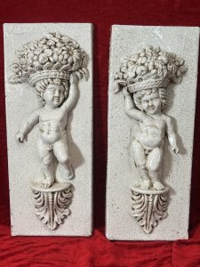 Fine Pair Of Marblesque Cherub Plaques With Cracked Glazed Marble Patina Large Pair Of Cherub Plaques, Both Posed Standing Upon Acanthus Leaf Plinth, With Opposite Hands Holding Large Fruit And Floral Bouquet Crowns. Condition - Very Good Antiqued Item, Minor Blemishes And Cracking Visible. Dimensions In Inches Height 27.5" X Width 10 3/4" X Depth 5" For Further Information Please Call Our Museum Curator On 07707 488566 Thank-you.