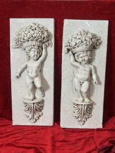Fine Pair Of Marblesque Cherub Plaques With Cracked Glazed Marble Patina Large Pair Of Cherub Plaques, Both Posed Standing Upon Acanthus Leaf Plinth, With Opposite Hands Holding Large Fruit And Floral Bouquet Crowns. Condition - Very Good Antiqued Item, Minor Blemishes And Cracking Visible. Dimensions In Inches Height 27.5" X Width 10 3/4" X Depth 5" For Further Information Please Call Our Museum Curator On 07707 488566 Thank-you.