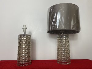 Pair Modern Art Contemporary Geometric Glass Lamps With Shades. Circa - Modern Reproduction Composition - Glass Condition - Used Pristine Matching Pair Of Modernistic Designer Glass Table Top Lamps, Both Cylindrical Bases In A Geometric Pattern With Holographic Finish In Champagne Colour. Singular Bulb Fixtures With British Corded Plug With On/Off Switch. Complete With Beige Gold Shade. Unused/ Unboxed Dimensions In Inches Height With Shades 19" Base Height Including Bulb Mount 15.5" Base Diameter 4 1/4"