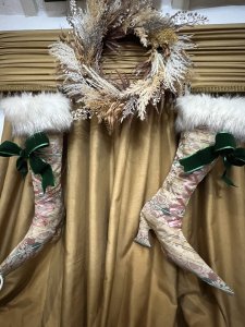 Pair Of Designer Opulent Christmas Stocking Boots. Bespoke designer stocking boots in dusky pink/ Green And Beige regency silk brocade. Faux lace up fronts in satin ribbon with large green bow. Fully lined in gold satin with matching fabric hanging loops. Quality white Speckled Faux fur Trim. Hand drawn pattern One Of A kind. Stunning edition to opulent Christmas decor. Buy them before they are gone won’t be on sale for long Dimensions Height 23” Width 15” heel to toe Top opening width 11” Hanging Loop 3” #christmas stockings #glamourstockingboots #Cheistmasdecor