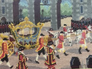 Queen Elizabeth II Coronation Vintage Wool-work Framed Tapestry Circa - 1950 Composition - Wool Thread Embroidery Listing Description Historic Wall Hanging.Hand Embroidered Wool Work Tapestry Depicting Queen Elizabeth II Coronation. Such An Enchanting Artwork Showing The Horse Drawn Coach With The Queen Inside Surrounded By Parading Guards Against Architectural Backdrop. Minor Missing Wool Please See Images. Set In Glazed Frame. Dimensions In Cms Height 28.5cm X Width35cm
