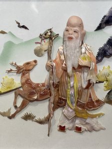 Oriental Chinese LAO SHOUXIN Deity Of Longevity Mother Of Pearl Artwork Signed Circa - 20th Century Composition - Mother of Pearl Listing Description Fine Antique Artwork Of Oriental Chinese LAO SHOUXIN Deity Of Longevity Central Of Oriental Landscape. Artwork Hand Crafted In Mother of Pearl And Precious Shell Formations With Finely Detailed Hand Painted Features. Showpiece Set Inside Glazed Black Lacquered Display Case And Signed By Artist. Dimensions In Inches Height 12" X Width 18 3/4"