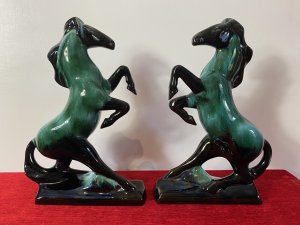 Pair Of Art Deco Style Terracotta Teal Drip Glazed Rearing Stallion Figurines Circa - 1960's Composition - Terracotta Shell With Kiln Fired Drip Glaze Listing Description Fine Pair Of Decorative Rearing Stallions In A Rich Black High Shine Lacquer, With Marble Teal Drip Over Glaze. Posed Arched Fetlocks, Sweeping Main And Long Tail Leading Into Rectangular Bases. Stunning Quality Pair of Horse Figurines With A Strong Art Deco Influence. A Beautiful Feminine Decorative Pair Of Figurines For Mantle , Cabinet Or Wall Display. Dimensions in Inches Height 14" Width 9.5" Depth 3"