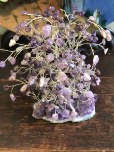 19th Century Amethyst & Silver Tree Of Life Set Upon Amethyst Stalactite Base. Circa - 1880 Composition - Solid Silver Branches Decorated With Amethyst Gemstones. Listing Description Beautiful Antique Sculptural Showpiece & Work Of Art Depicting A Elaborate Cabinet Of Curiosities ‘Tree Of Life’. An Abundance Of Twisted Vines Of Solid Silver Wire Create The Sturdy Trunk And Branches That Reach Out Bearing Over 120 Carats Of Genuine Individual Amethyst Gemstones. Original Antique Hand Crafted By Parisian Jeweller During The Late 19th Century And Set Upon Large Breathtaking Rare Amethyst Stalactite. The Stalactite Exhibits A Incredible Formation Of Large Crystals In A Variety Of Rich Purple Hues. Very Rare Museum Grade Collectors Item. Provenance Purchased From Parisian Collector During Early 20th Century. Part Of Lord Hill Museum’s Private Collection. Condition- Original Antique As Expected There Are A Few Amethyst Stones Missing From Branches Due To The Age/Use And Delicate Nature Of This Showpiece. If You Require More Information Or Images Please Contact Us On 07376618513 Thank-you Dimensions In Inches Height 9” Width 5”