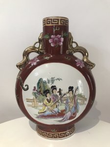 Vintage Cantonese Oriental Vase Komodo Dragon Guilt Handles With Family Portraits Of Men With Children On One Side And Ladies Playing Lutes On The Other Hand Painted On Porcelain With Lotus Flowers And Greek Key Style Embellishments Stamped On Base Beautiful Artists Work Stunning Shaped Vase Dimensions In Inches Height 15.5” Width 11” Depth 4”