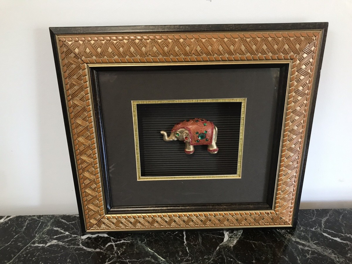 Primary image for Indian Minature Carved Elephant In A Carved Guilt Picture Frame