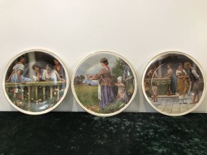 Collection Of 3 Decorative Porcelain Wall Plates Plate 1 By Eugene de Blaas Entitled The Balcony Ladies Gazing Over A Stone Balcony Plate 2 By Myles Burkett Foster Entitled Returning Home Mother And Child Gathering Rhubarb In A Field Plate 3 By Eugene de Blaas Entitled The Proposal Conversation In The Market Square Lovely Colours And Detail Dimensions Diameter 10.5”
