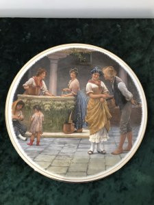 Collection Of 3 Decorative Porcelain Wall Plates Plate 1 By Eugene de Blaas Entitled The Balcony Ladies Gazing Over A Stone Balcony Plate 2 By Myles Burkett Foster Entitled Returning Home Mother And Child Gathering Rhubarb In A Field Plate 3 By Eugene de Blaas Entitled The Proposal Conversation In The Market Square Lovely Colours And Detail Dimensions Diameter 10.5”