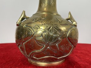 Ornate Chinese Brass Temple Vase With Frogs And Lotus Leaf Engraved Decoration. Circa ~ 1880 Thin Stem Neck Adorned With Cloud And Maze Decorative Engravings With Bulbous Base Decorated With Frogs, Lilly Pads And Lotus Leaves. Very Unusual Piece With Harlequin Decoration On The Base. A Heavy Piece Which Has Been Very Finely Engraved. Unsigned Dimensions In Inches Height 10” Width 6.5”