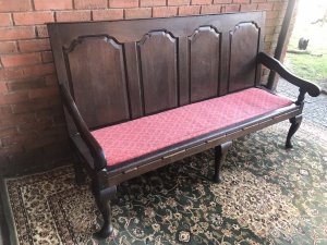 Period Antique 1760 George III Four Panel ‘Great Hall’ Oak Settle. Solid Oak Bench With Gothic Panelled Back, Sweeping Elegant Arm Rests With Red Fleur De Lys Style Motif Upholstered Cushion And Ship Work Roping Supports. Cabriole Shape Leg Supports Hand Carved During The Reign Of George III 1760 Provenance Part Of Lord Hill Museum Collection Please Note This Is A Genuine Antique Dated 1760 Due To Age There Are Signs Of Wear The Back Left Leg Has Previously Been Mended A Metal Brace Fitted For Support Dimensions In Inches Height Width Depth