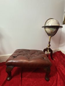 Vintage Deep Buttoned Red Leather Chesterfield Footstool Set Upon Mahogany Queen Anne Legs Circa - Vintage Composition - Wood Frame/ Leather Upholstery Listing Description Wonderful Vintage Original Red Deep Buttoned Leather Upholstered Footstool In Iconic Diamond Chesterfield Pattern. Rectangular Shape With Hardwood Frame With Decorative Polished Mahogany Queen Anne Legs. Condition - Very Good Used Showing Minor Scratches/ Signs Of Wear Due To Usage / A Slight Tear To Leather Please See Images. Dimensions In Inches Height From Floor 12" Width 24" Depth 19"