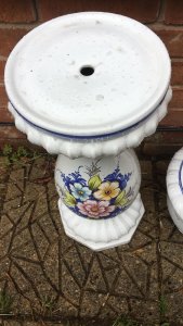 Italianate Porcelain Floral Hand Painted Jardiniere On Ornate Stand Circa - Vintage Composition- Ceramic Bulbous Bowl With Scalloped Relief Edging And Blue Accent Lines. The Front Elevation Is Hand Painted With Three Brightly Coloured Floral Motifs With Green/ Blue Foliage. The Bowl Sits Upon Elegantly Shaped Cylindrical Stand Decorated With Matching Floral Sprays And Octagonal Base. Stunning Planter For Floral Display In Garden Room/ Kitchen/ Lounge Condition- Vintage Used No Damage Lovely Condition Provenance Purchased From Grand Villa In Tuscany Italy. Dimensions In Cms Height 76cm Vase Height 21cm Base Height 55cm Vase Width 27cm