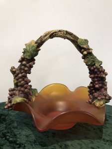 French Reproduction Ornate Grape Vine Handle Orange Art Glass Fruit Bowl Porcelain Grape Vine Handle With Purple Fruit And Green Vine Leaves With Stunning Shaped Burnt Orange Frosted Glass Fruit Bowl Decorative Item Pristine Condition Dimensions In Inches Height 11” Width 12”