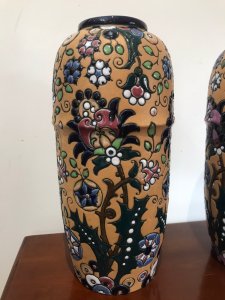 Stunning Pair Of Art Noveau Period Museum Grade Amphora Vases Czechoslovakian Boarder Made Amphora Vases Clearly Marked Stamp On The Bases Hand Crafted Earth Tone Peach Ridge Boarder Vase With Geometric Floral Pattern In High Shine Coloured Glazes Stunning Quality Collectors Item Immaculate Condition Provenance Lord Hill Museum Fine Art Collection Dimensions In Inches Height 14” Width 6.5” Vase Diameter 20.5” Top Rim Diameter 11”