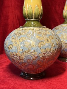 Pair Of Period Art Nouveau Doulton Lambeth Slater Vases By Artist Catherine Francis Circa - 1890 Composition - Ceramic Listing Description Wonderful Pair Of Tall Period Art Nouveau Doulton Lambeth Slater Vases. Rare Matching Pair With Fluted Mouth Opening With Elongated Tulip Neck. Set Upon A Boubous Body Richly Adorned With Textural Floral Folate Pattern Comprised Of Stars, Flowers And Scroll Ornamentation. Both With Circular Pediments Stamped On Underside Doulton Lambeth ENGLAND With Doulton Slater Patent No 8608 Stamped F Artist Catherine Francis. The Main Body Of The Vases Have A Turquoise Backdrop With Folate Pattern In Cream And Gold Gilding. The Neck Begins With Olive Green Acanthus Leaf Pattern Leading Into Ombre Decoration Of Yellow And Terracotta. Condition - Very Good Showing Signs Of Wear To Glaze, Relief Pattern And Gilding Conducive To Age And Usage. Chip To Base Of Left Vase. No Cracks Dimensions In Inches Height 17" Width 9" x Depth 9"