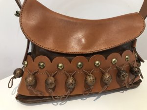 Stunning Rodo Designer Scalloped Edge Tan Leather Pom Pom Handbag Gorgeous Wooden Pom Poms On Waxed Cotton Cords All Around The Front Along A Scalloped Edge Decorated With Brass Studs Quality Thick Leather With Decorative Top Stitching Lovely Sturdy Handle With Belt Buckle Design Both Sides Magnetic Clasp Closure Absolutely Stunning Inside Is Still Stuffed With Original RODO Tissue Paper Almost New A Few Minor Marks From Storage Lovely Condition Really Unusual Designer Handbag Inspired By The Rodeo These Bags Are Very Expensive New And Are Hand Crafted In Italy From The Finest Leathers Dimensions In Inches Bag Height 7.5” Bag width 11” Bag Height with Handle Extended 13” Depth 2.5”
