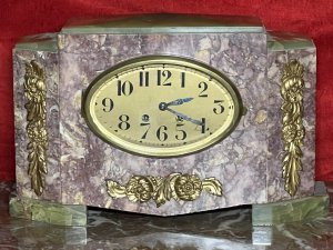 French Art Deco Marble Mantle Clock With Matching Garnitures Circa - 1920 Composition - Solid Marble/ Metal Filigree Listing Description Exceptional Period Art Deco Mantle Clock Garniture. Timepiece Comprised Of Rectangular Central Pediment, With Surrounding Canted Corner Pediments Set Upon Ornate Green Marble Feet And Matching Top Housing. All Embellished With Ornate Floral Plaques. Oval Brass Numeral Dial Run By 8 Day Mechanical Movement Wound On Clock Face. Set Complete With Pair Of Matching Octagonal Candles Garnitures. Dimensions In Inches Clock Height 8 3/4" X Width 13.5" X Depth 5 1/4" Garnitures Height 5.5" X Width 5 1/4" X Depth 4 1/4" For Any Further Information Please Call The Curator On 07707 488 566 Thank-you