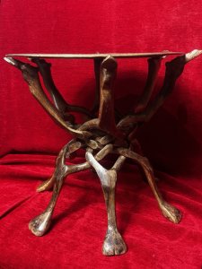 Decorative Brass Charger And Carved Camel Base Fruitwood Occasional Table Circa - Vintage Composition - Fruitwood/Brass Top Listing Description Ornate Floral Engraved Brass Charger Table Top Sits Upon A Carved Camel Pediment Base. The Base Is Carved Out Of A Single Piece Of Wood. The Base Constantinas Out For Table Construction Then Neatly Folds Down. Dimensions In Cm Height 43cm X Width 48cm