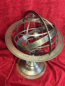 The Workings Of A Armillary Sphere. At the centre is a small brass sphere representing the Earth. Above it rotate a set of rings representing the heavens - the celestial sphere - with one complete revolution approximating 24 hours.