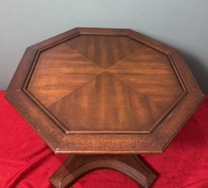 Beautiful Coffee Table In The Art Deco Style. Sits Upon Column Stretcher And X Shaped Pedestal With Bun Feet. Composition - Elm Wood. Height 41.5cm X Width 56cm (Table Top) X Base Width 39cm.
