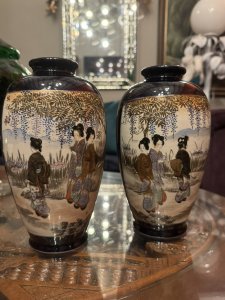 On Reverse Of Vases A Scene Of Native Flowers And Grasses With Gilt Work. Vases Signed By Maker On Base. Composition - Porcelain. Height 21.5cm X Width 13cm X Depth 13cm.