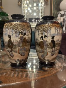 On Reverse Of Vases A Scene Of Native Flowers And Grasses With Gilt Work. Vases Signed By Maker On Base. Composition - Porcelain. Height 21.5cm X Width 13cm X Depth 13cm.