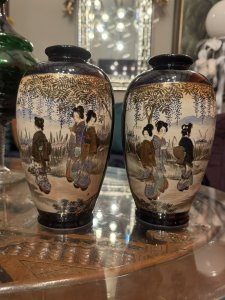 On Reverse Of Vases A Scene Of Native Flowers And Grasses With Gilt Work. Vases Signed By Maker On Base. Composition - Porcelain. Height 21.5cm X Width 13cm X Depth 13cm.