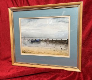 Artist - M Wainwright. Artwork Title - 'Reflections In The Sand'. Composition - Watercolour On Vellum. Fine Art Watercolour Depicting Hoylake Beach Scene Looking Out Towards The Sea. Rowing Boat Moored Next To Water Break Barrier, With Couple Walking Up The Beach Together.