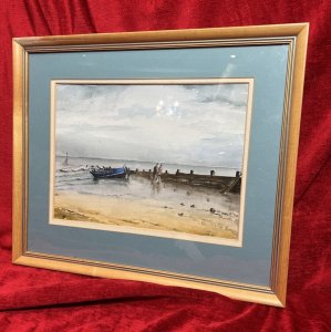 Artist - M Wainwright. Artwork Title - 'Reflections In The Sand'. Composition - Watercolour On Vellum. Fine Art Watercolour Depicting Hoylake Beach Scene Looking Out Towards The Sea. Rowing Boat Moored Next To Water Break Barrier, With Couple Walking Up The Beach Together.