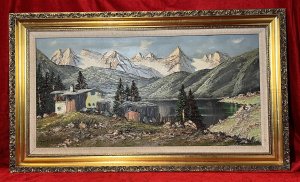 Front View Of Austrian Chalets Around The Lake With Surrounding Rolling Hills And Icy Mountains In The Distance. Vibrant Tonal Colour Pallet Of Vivid Greens, Deep Grey, Brown Tones, Sky Blue And White, All Spread Thickly Over Canvas Using Pallet Knife Technique.