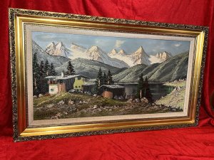 Front View Of Austrian Chalets Around The Lake With Surrounding Rolling Hills And Icy Mountains In The Distance. Vibrant Tonal Colour Pallet Of Vivid Greens, Deep Grey, Brown Tones, Sky Blue And White, All Spread Thickly Over Canvas Using Pallet Knife Technique.