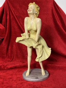Wearing Designer William Travilla White Cocktail Dress, With Her Skirt Blowing Upwards Due to A Underground Passing Train. Sculpture From Original Image From 1955 Film 'The Severn Year Itch' Directed By Billy Wilder.