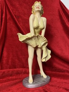 Wearing Designer William Travilla White Cocktail Dress, With Her Skirt Blowing Upwards Due to A Underground Passing Train. Sculpture From Original Image From 1955 Film 'The Severn Year Itch' Directed By Billy Wilder.