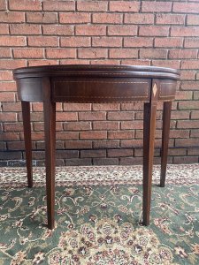 Stunning Period Antique George III Demi Lune Tea Table In Rich Plum Mahogany. Demi Lune Top Folds Out To Create Circular Turn Over Table Top With Decorative Satinwood Herringbone Inlays All Around Top Edge Set On Original Antique Brass Hinges.