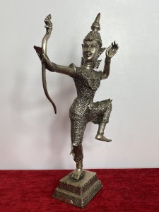 The Female Buddha Holds Snake Motif Bow In Straightened Arm With Left Limbs Bent In Buddhist Pose.Wonderful Facial Details With Delicate Hands. Composition - Bronze Over Painted In Silver Plate. A Rare Collectors Piece.