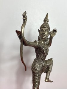 The Female Buddha Holds Snake Motif Bow In Straightened Arm With Left Limbs Bent In Buddhist Pose.Wonderful Facial Details With Delicate Hands. Composition - Bronze Over Painted In Silver Plate. A Rare Collectors Piece.