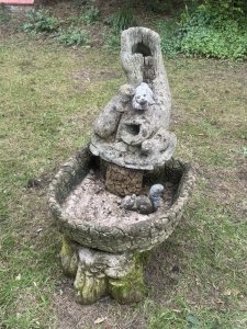 Trio Family Of Otters Entwined Around Log Feature As Top Section With Holes In The Mouths To Allow Flow Of Water For Waterfall Feature. Total 6 Pc - Top Otter Section, Squirrel, Water Bowl, Pebble Base 3Pcs.
