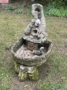 Trio Family Of Otters Entwined Around Log Feature As Top Section With Holes In The Mouths To Allow Flow Of Water For Waterfall Feature. Total 6 Pc - Top Otter Section, Squirrel, Water Bowl, Pebble Base 3Pcs.